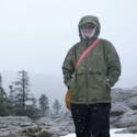 Jenna getting snowed on on a mountaintop in Vancouver
